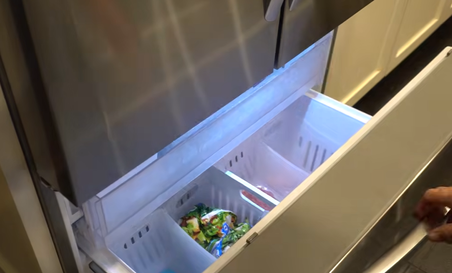 LG LRFLC2706S open bottom freezer drawer with two storage sections